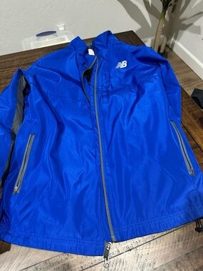 SOLD New Balance Men's Royal Blue Lightweight Jacket with Reflective Accents